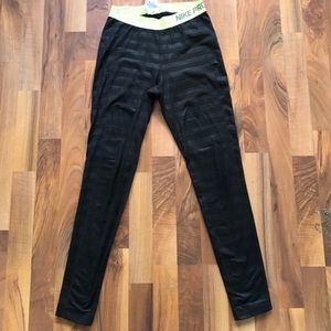 Black and neon green Nike leggings.